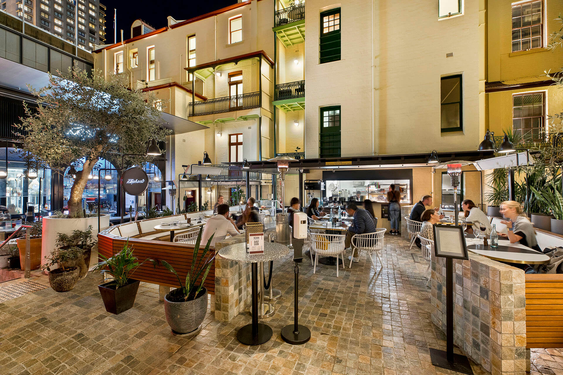 Busy outdoor commercial area with dining space